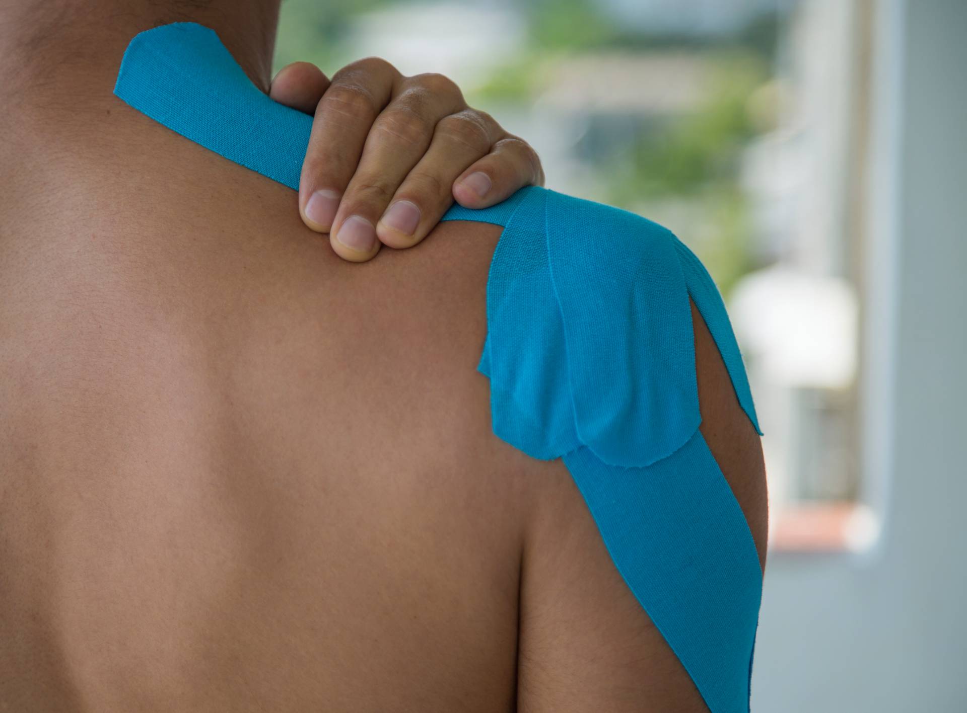 Adhesive bandage on shoulder