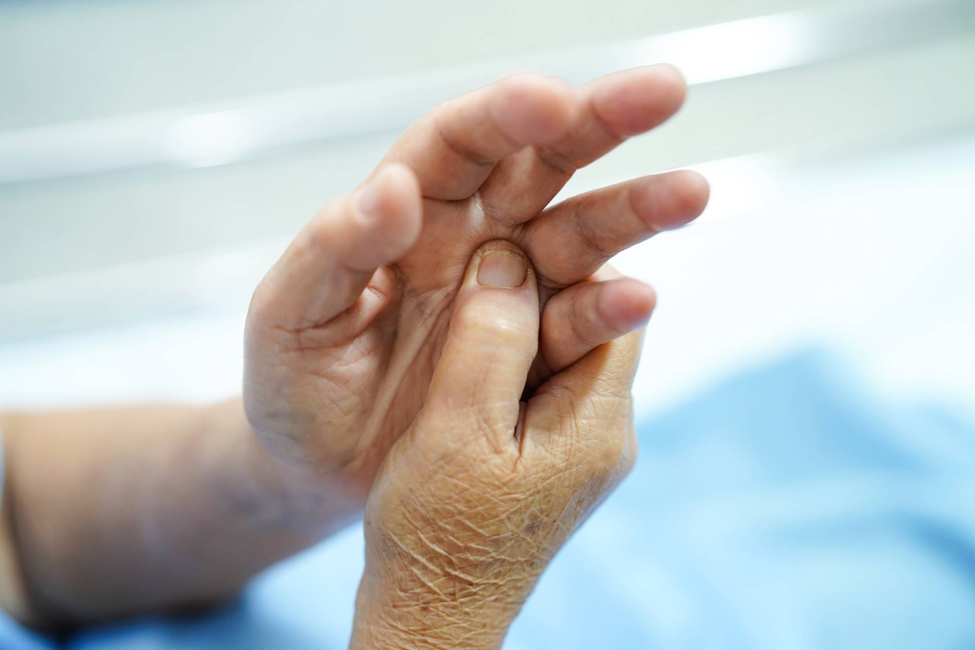asian-senior-woman-patient-feel-pain-her-hand-on-b