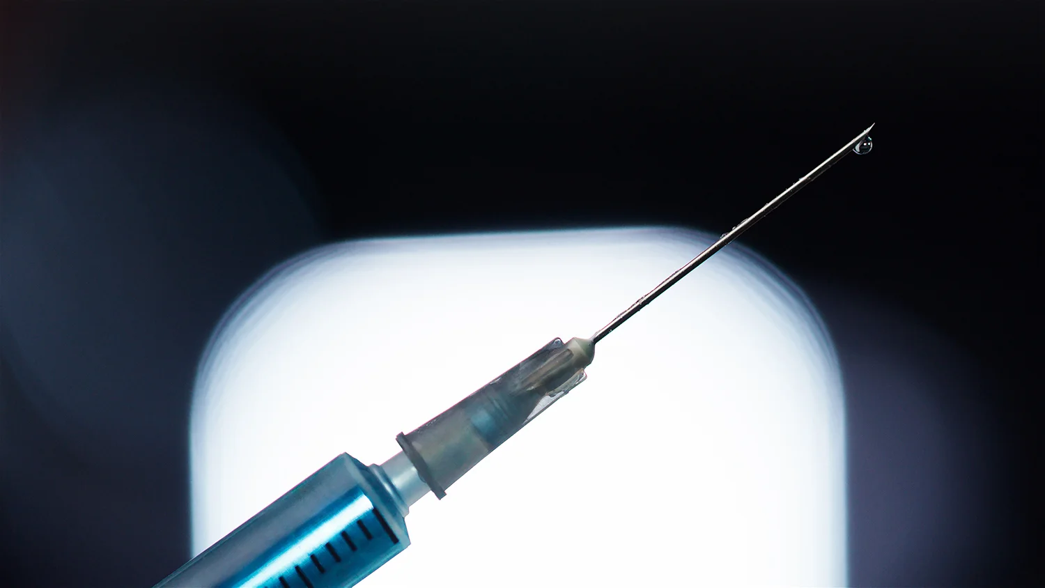 close up of syringe being prepared for injection