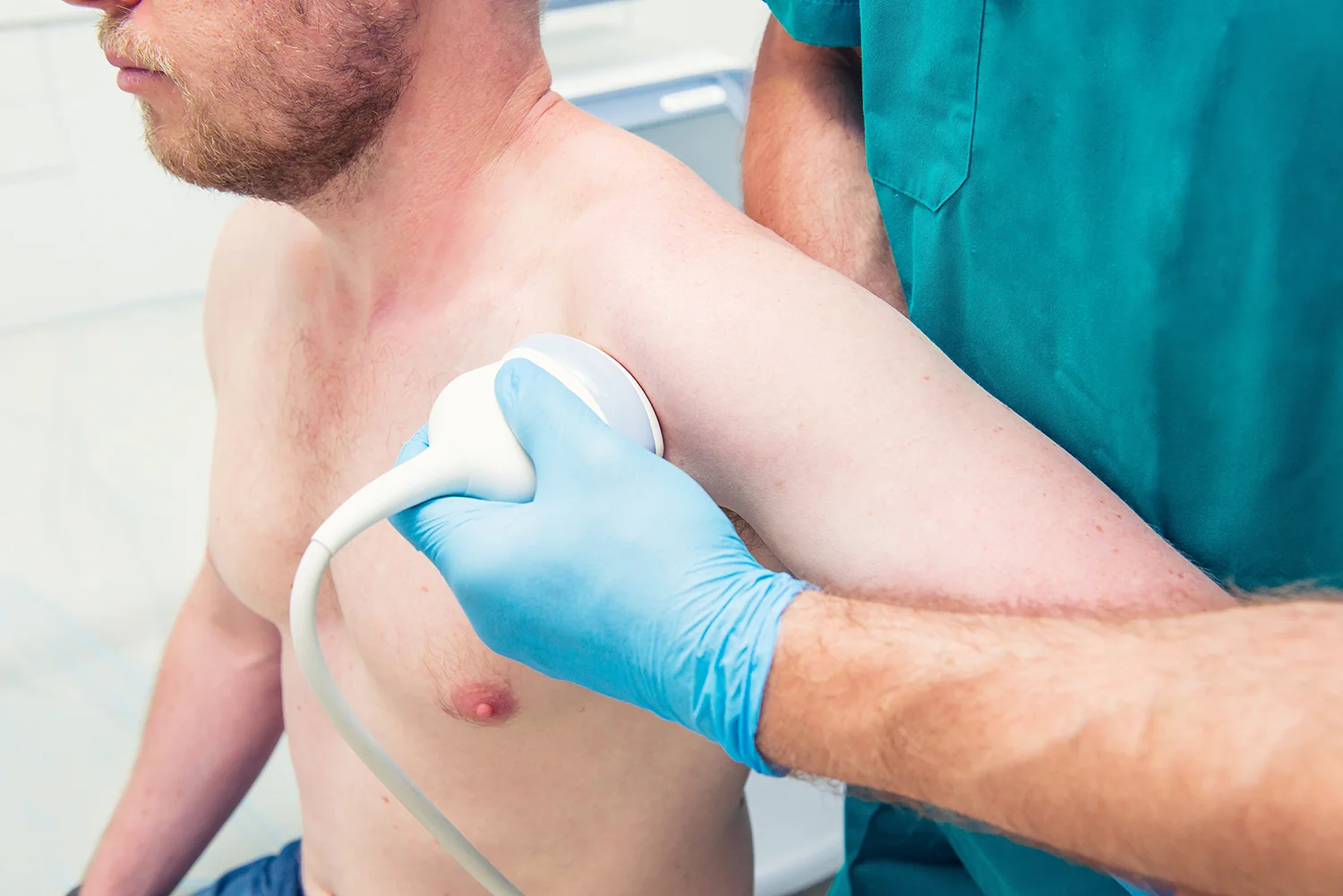 orthopedist doctor conducting ultrasound